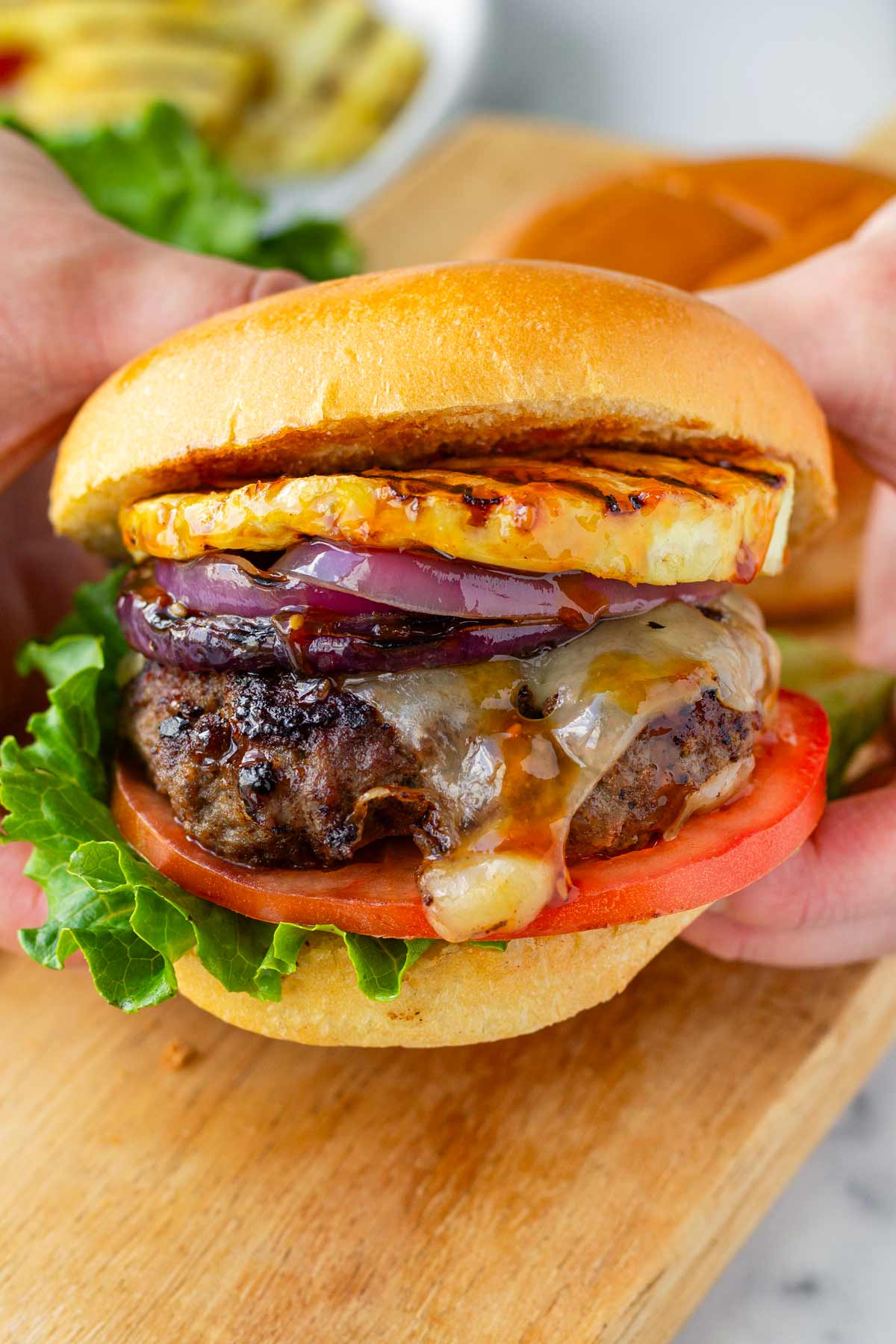 holding a burger with hands
