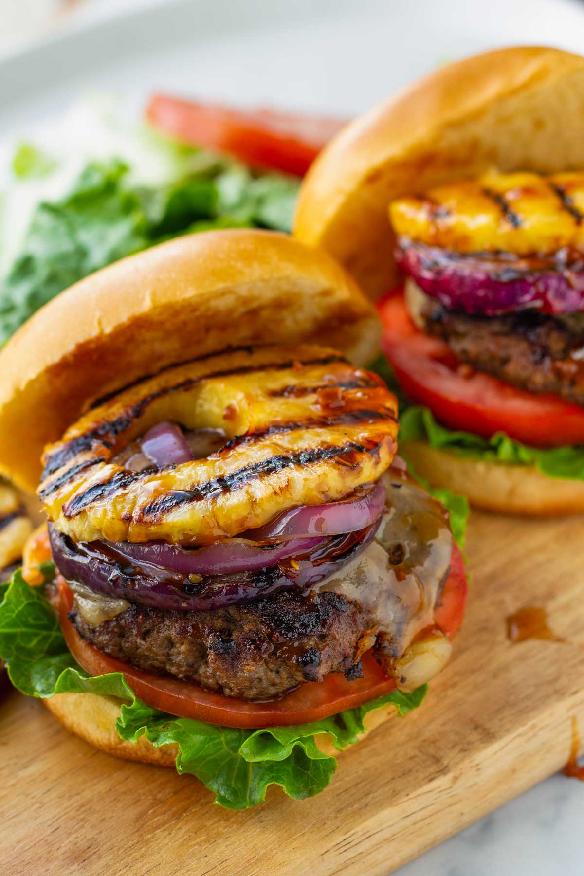 pineapple teriyaki burgers on a serving board