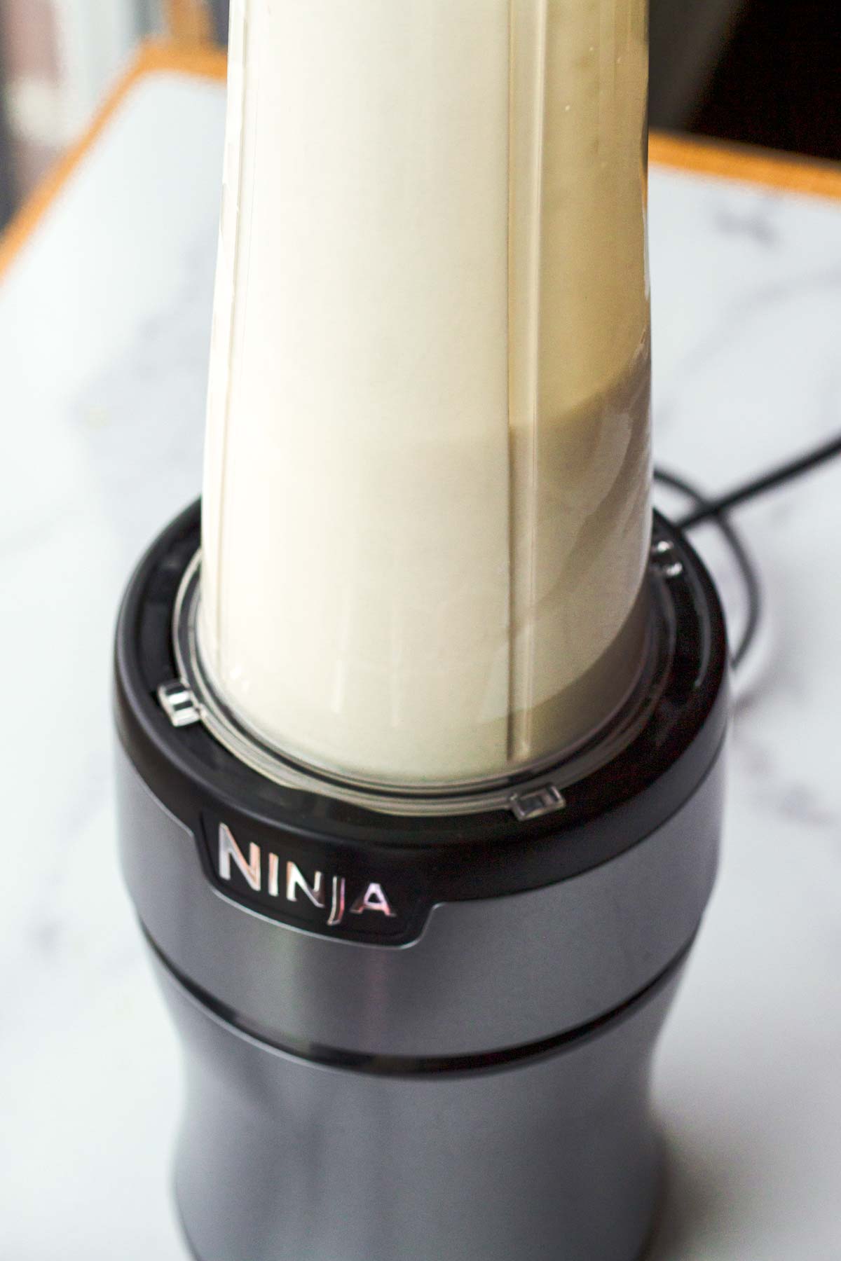 blended ice cream base inside a blender
