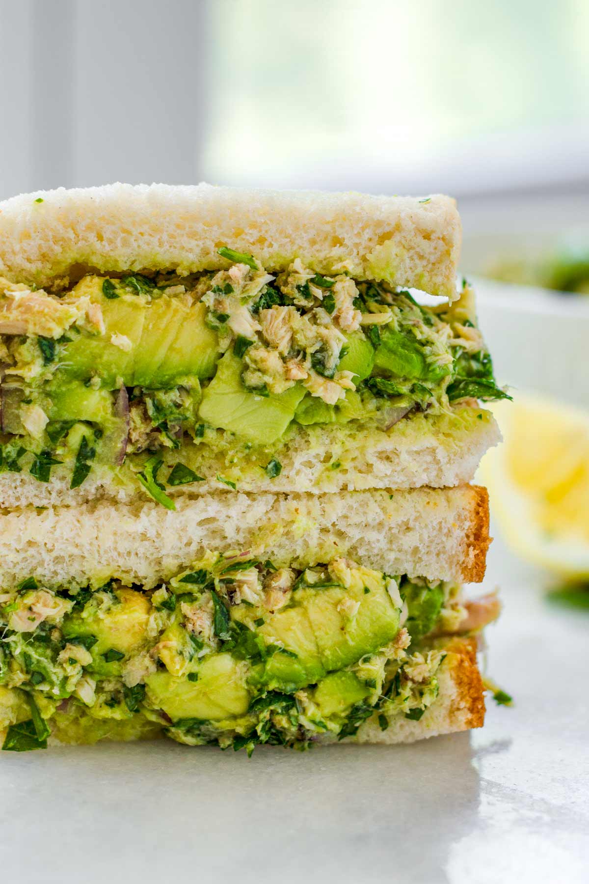 avocado tuna salad sandwiches stacked