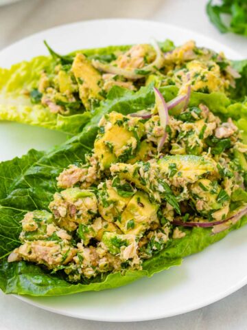 light avocado tuna salad over lettuce boats