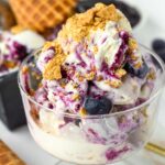 full scoops of blueberry cheesecake ice cream with graham cracker topping
