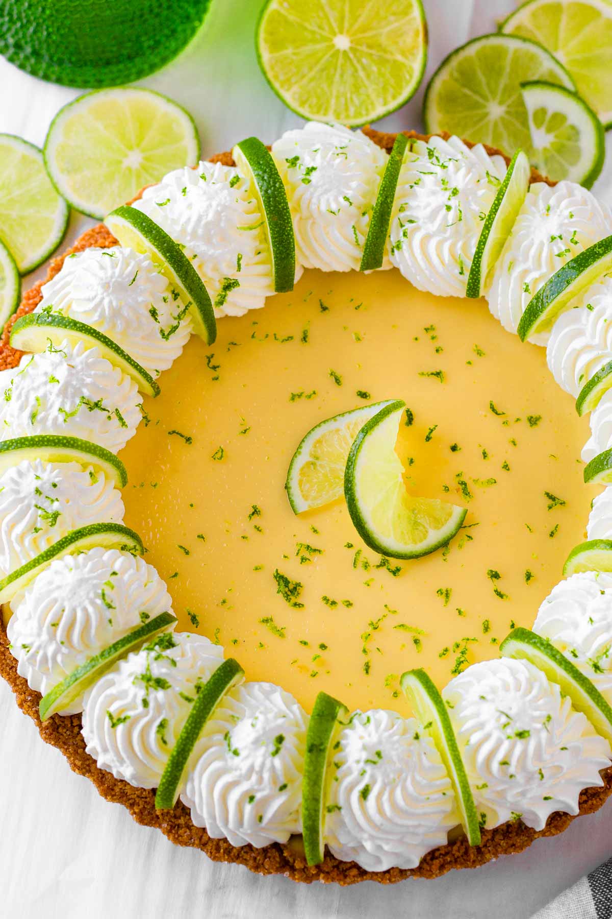 easy homemade key lime pie with whipped cream and fresh lime slices