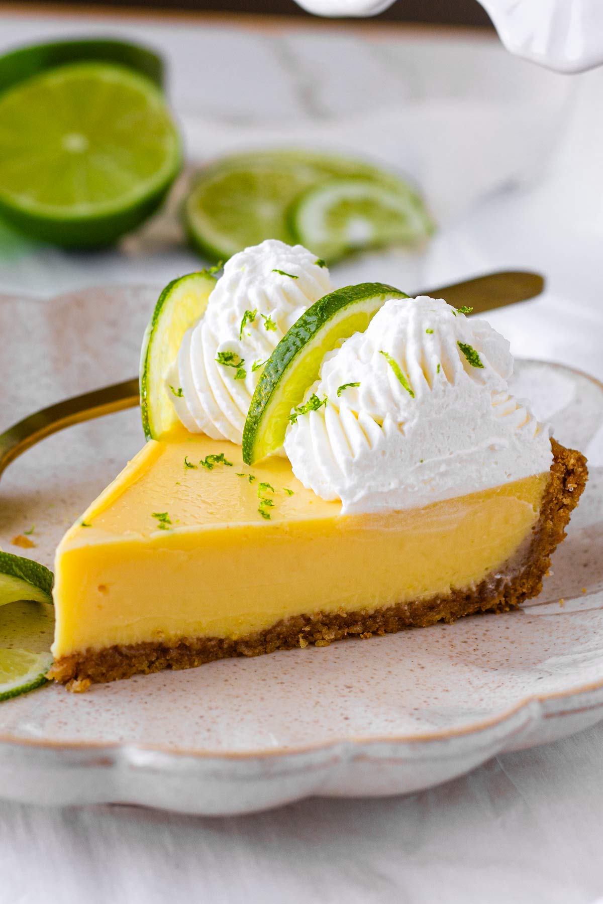 a slice of key lime pie on a plate