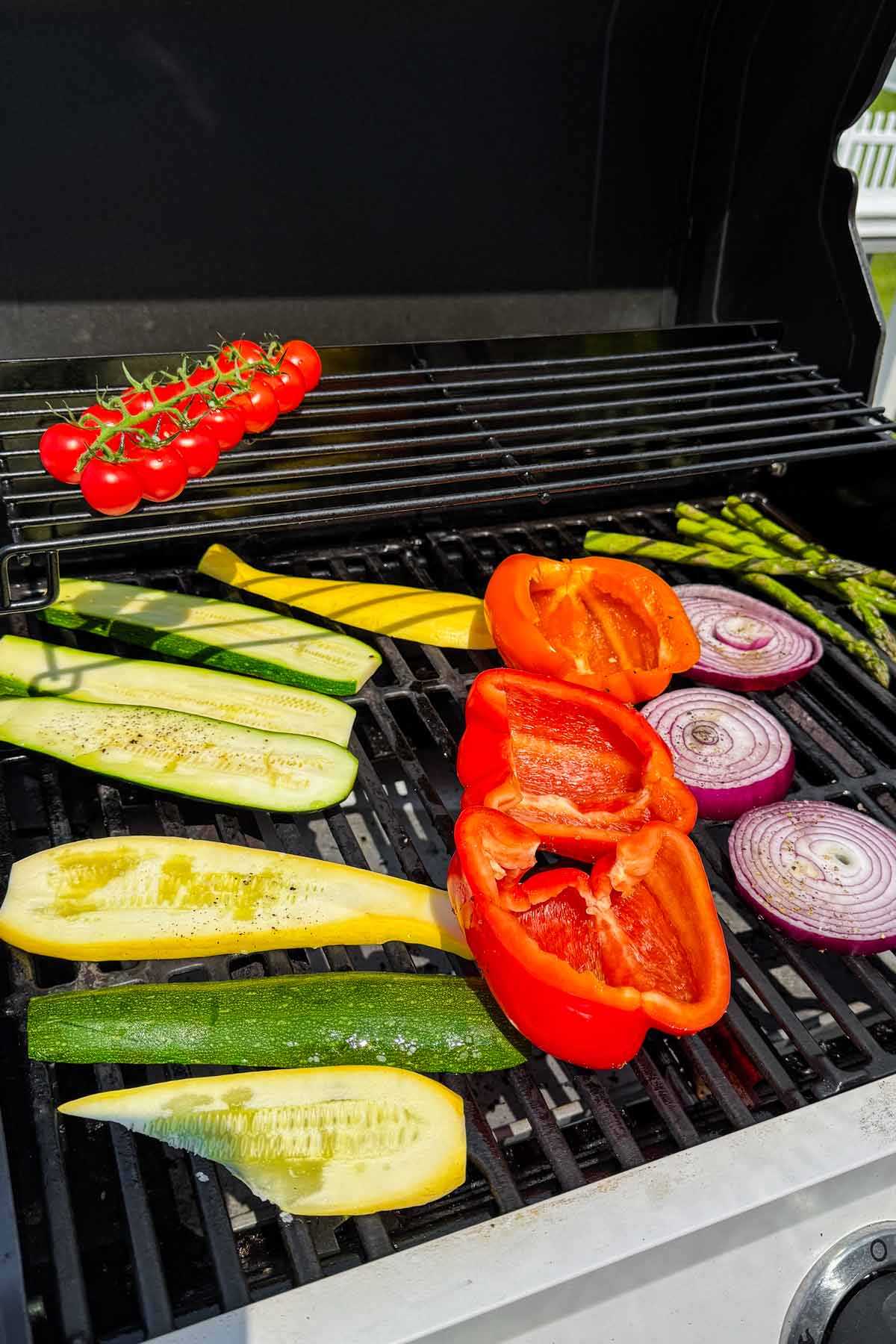 arranged sliced vegetables on the grill