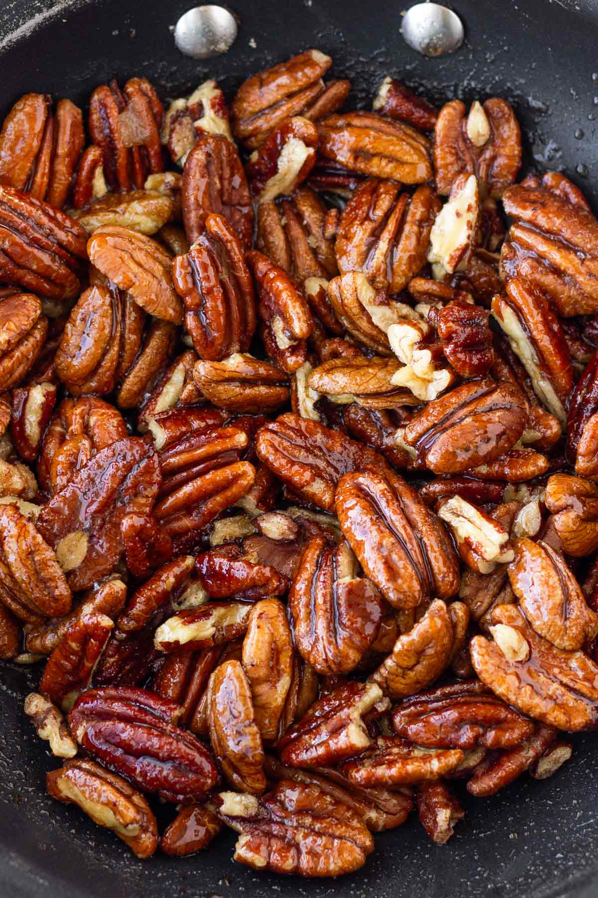 candied pecans in skillet
