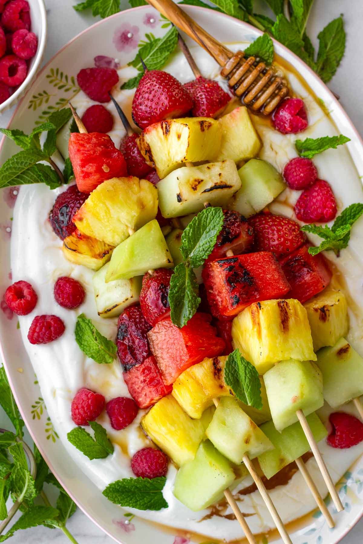 grilled fruit kabobs on bed of yogurt