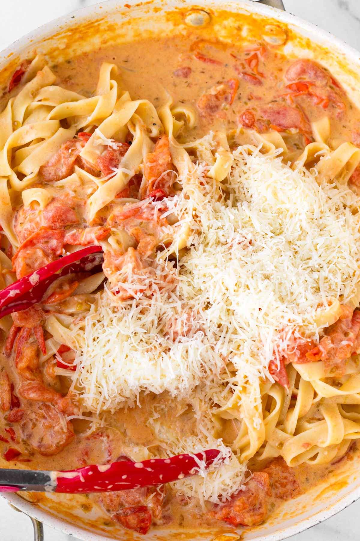 added parmesan cheese to the tomato pasta dish