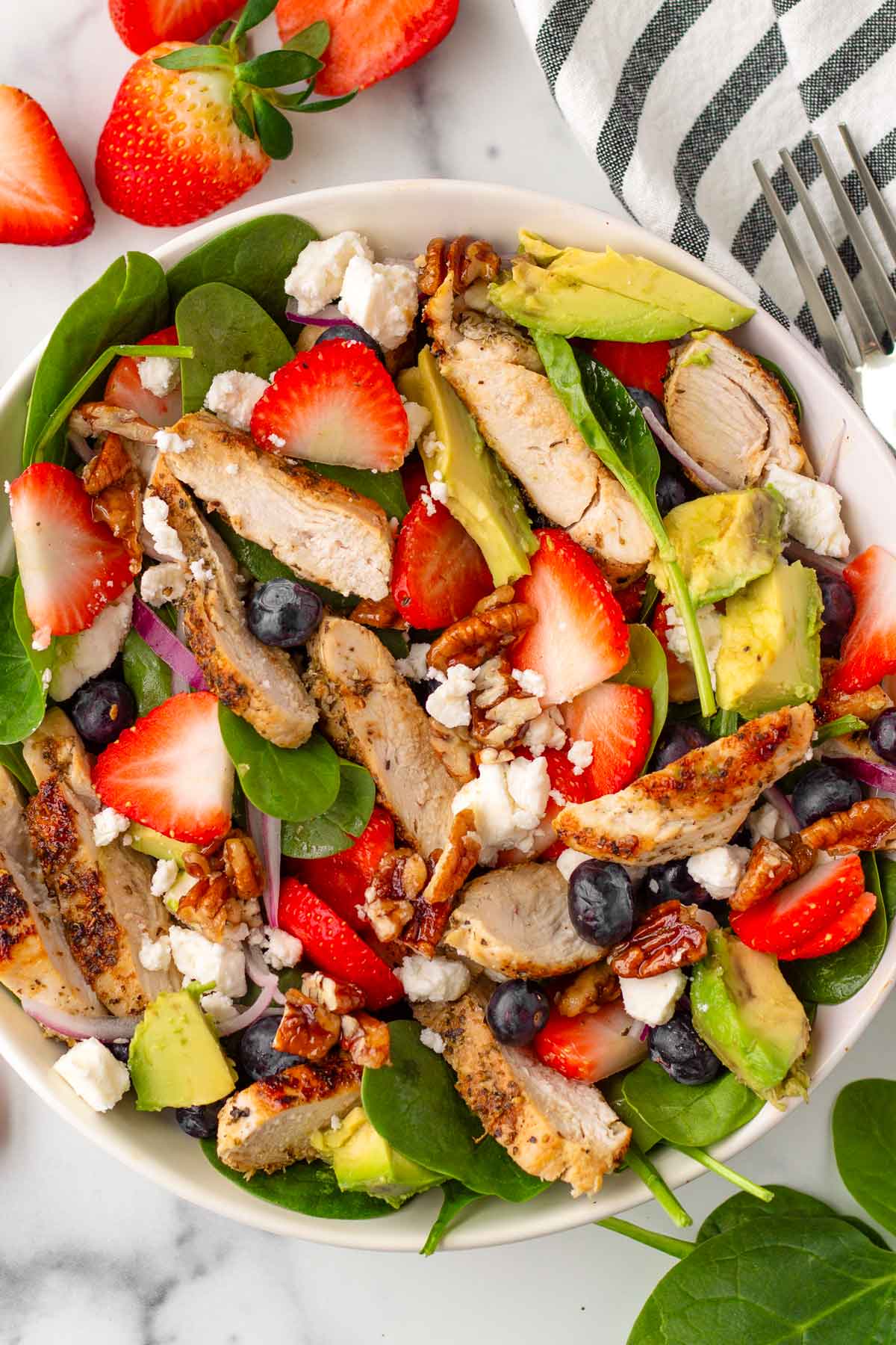 assembled ingredients for the strawberry chicken salad in a bowl