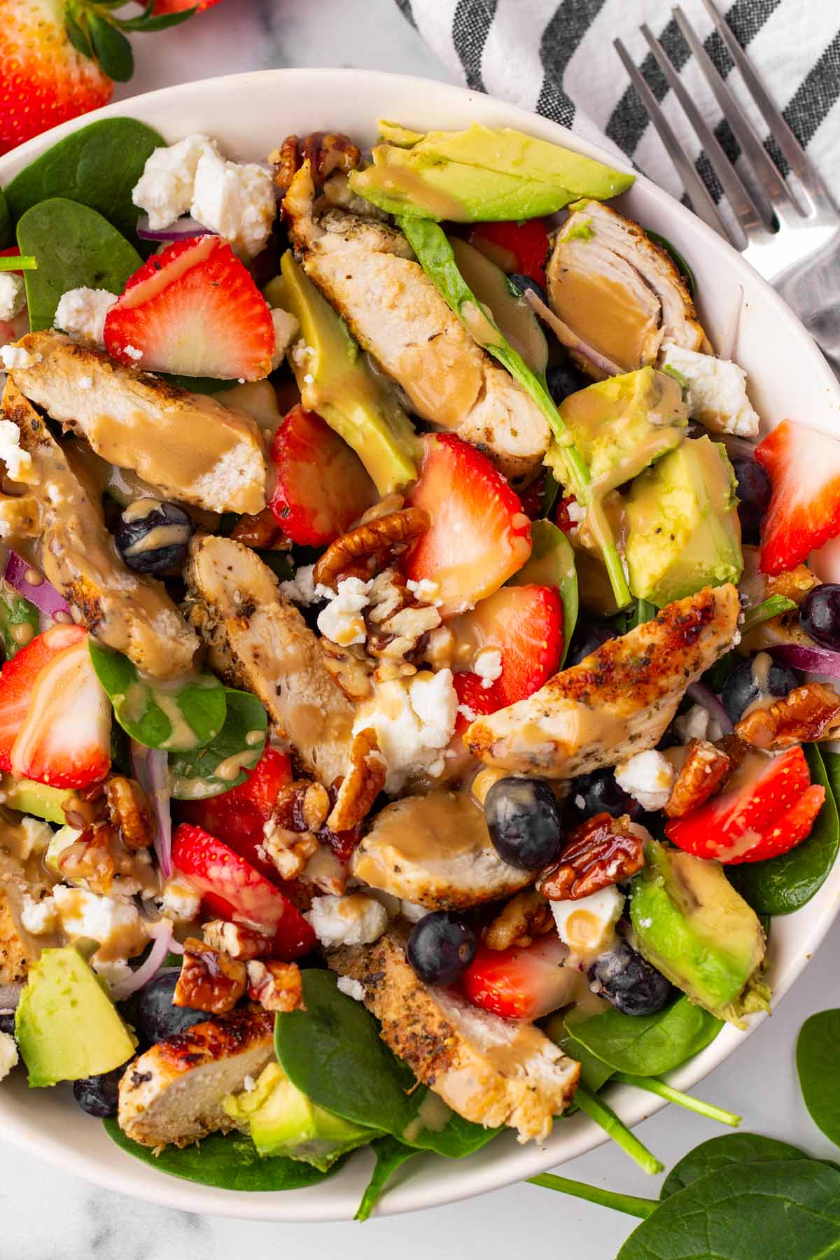 bowl of strawberry chicken salad with creamy balsamic dressing