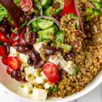 mediterranean lentil salad tossed in a bowl