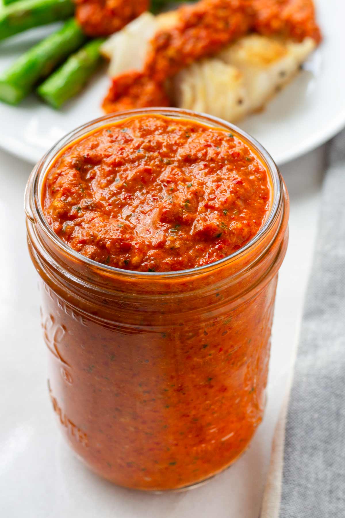 red romesco sauce in a mason jar