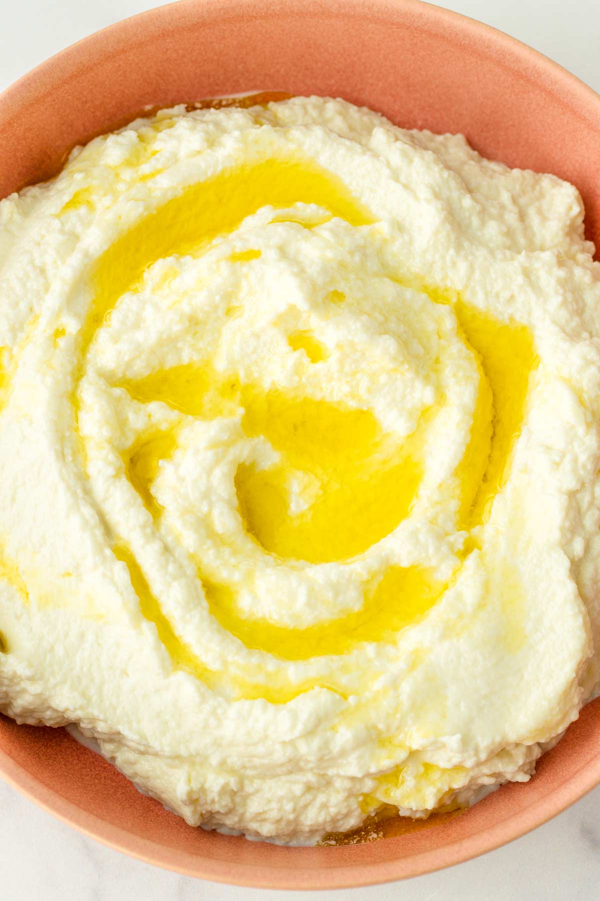 whipped burrata spread on bowl with olive oil