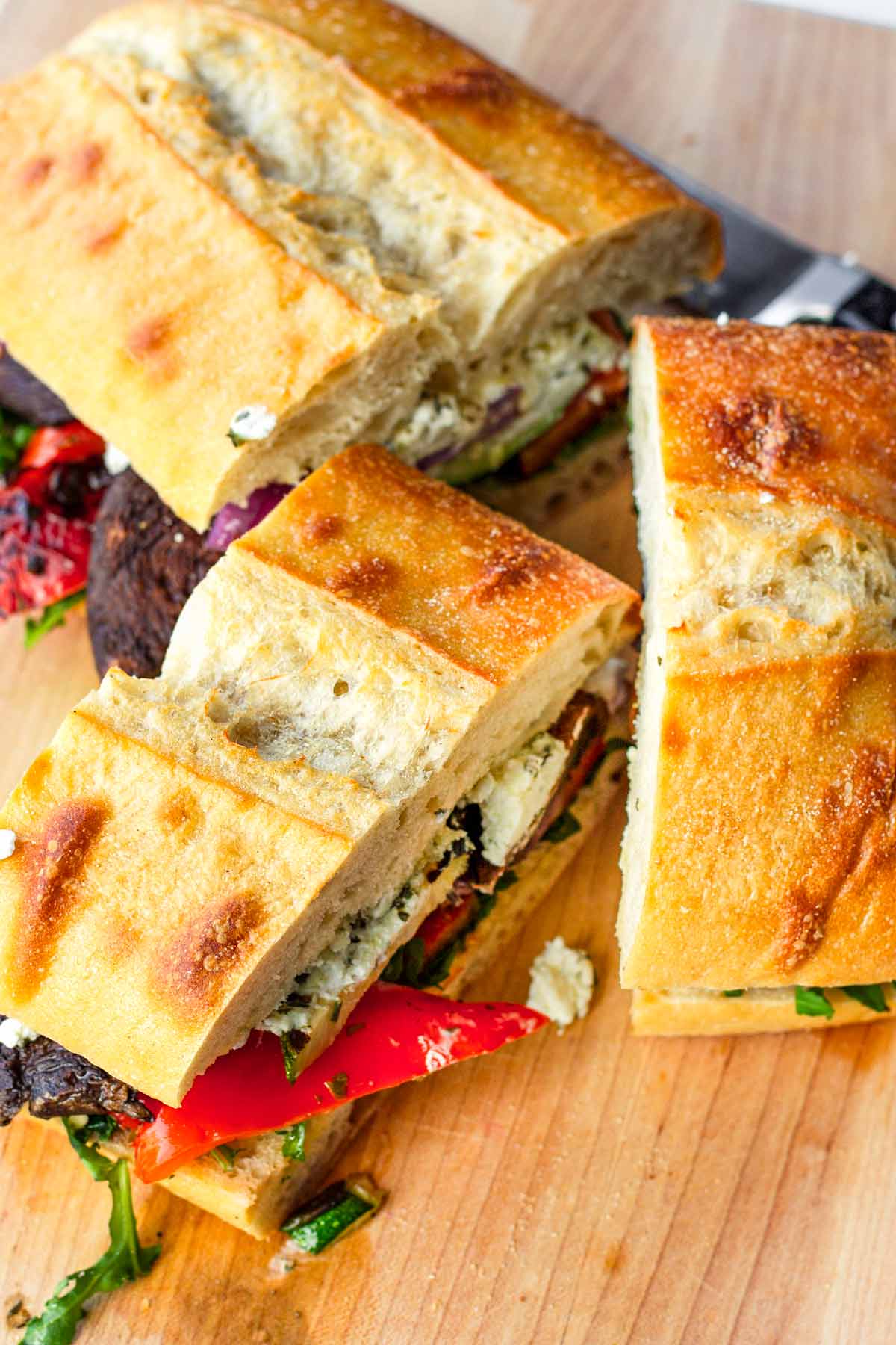 sliced grilled veg sandwich into thirds
