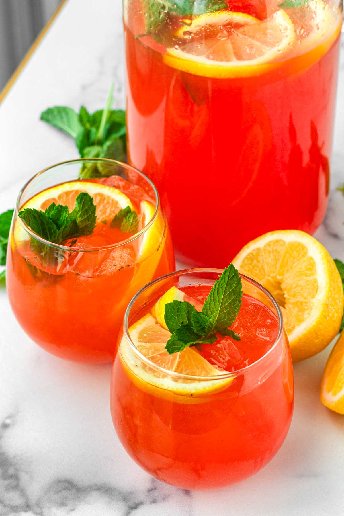 strawberry lemonade homemade in glasses and a pitcher