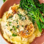 creamy garlic parmesan chicken with mashed potatoes and broccolini