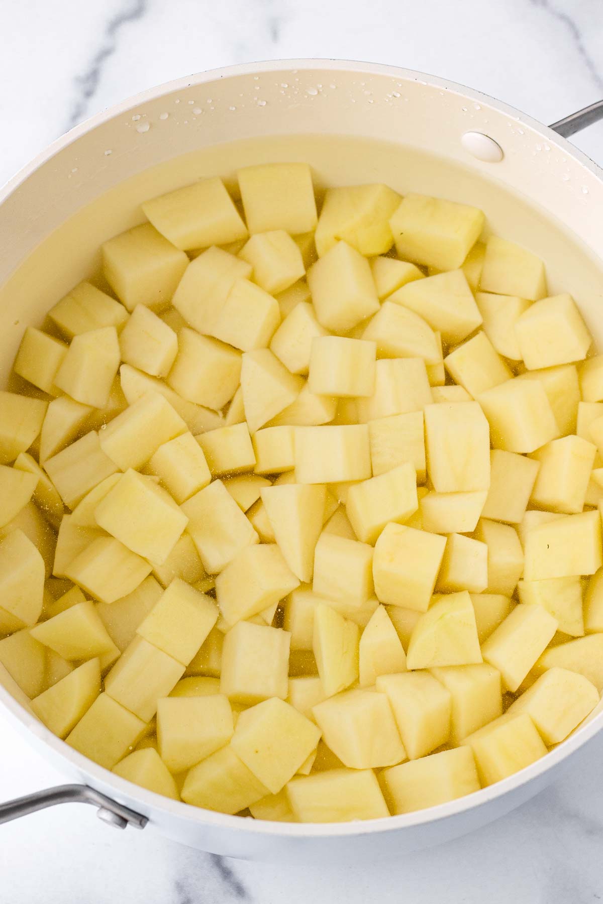 diced potatoes in water in a pot