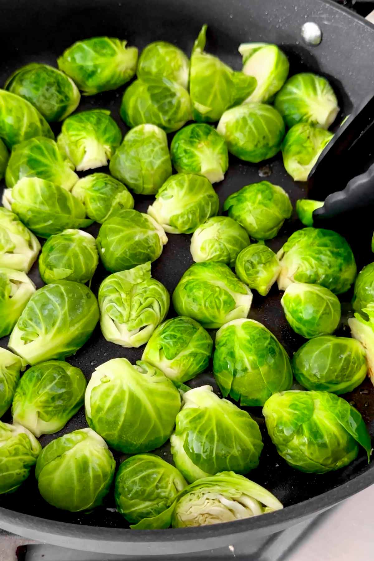 searing the brussels sprouts in skillet flat side down