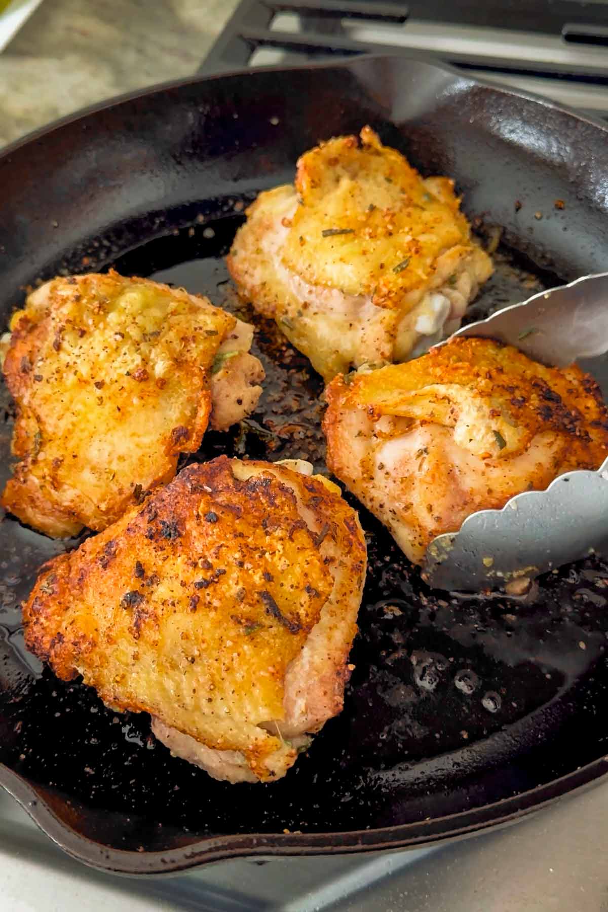 searing skin-on chicken thighs in cast iron pan