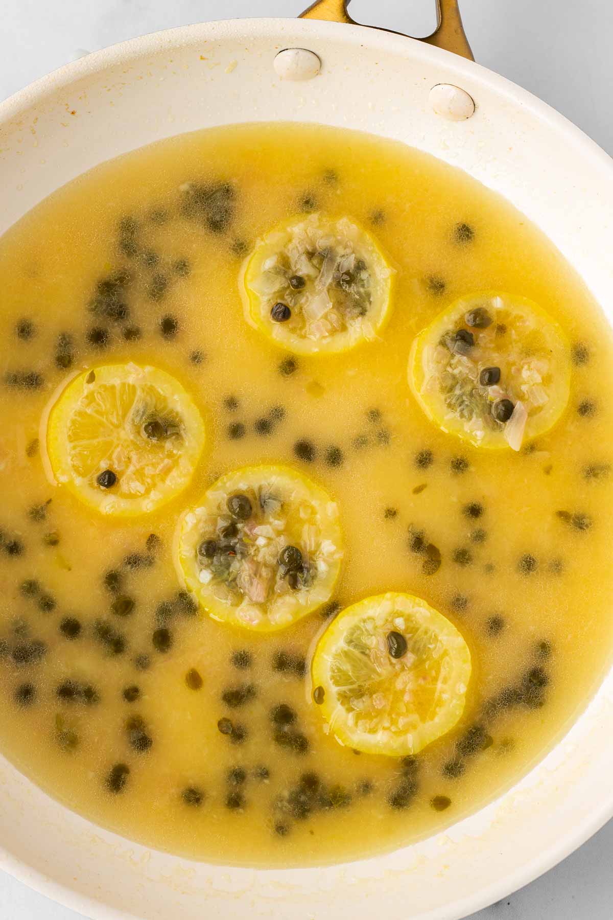 lemon juice and liquid added to the pan with the aromatics