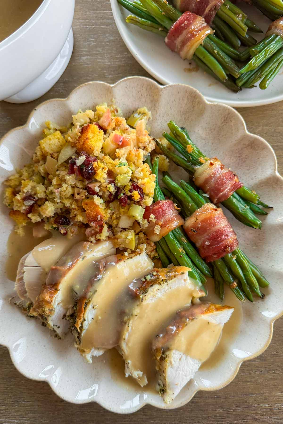 thanksgiving dinner plate with green bean bundles, stuffing, turkey