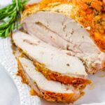 sliced juicy brined turkey breast with glaze
