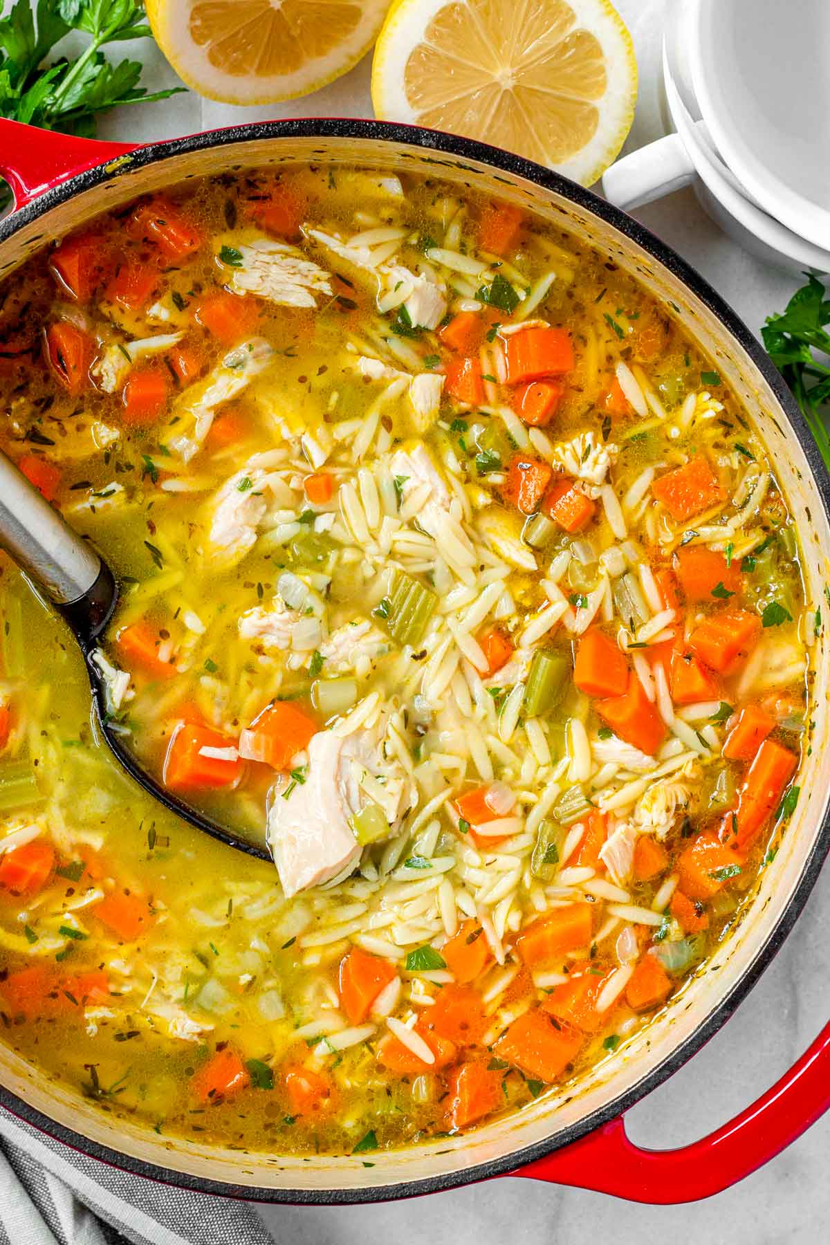 leftover turkey soup with vegetables and orzo in a pot
