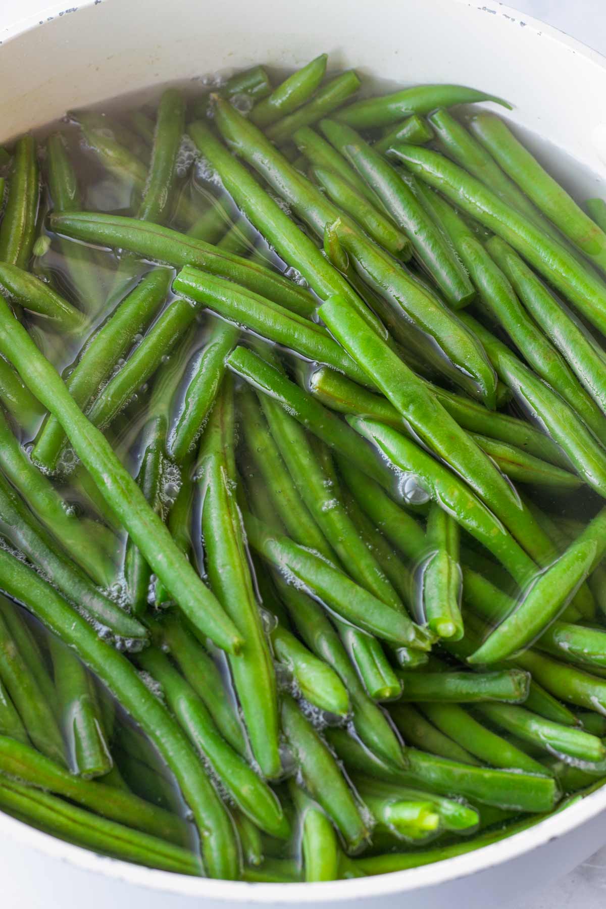 blanching green beans in a pot