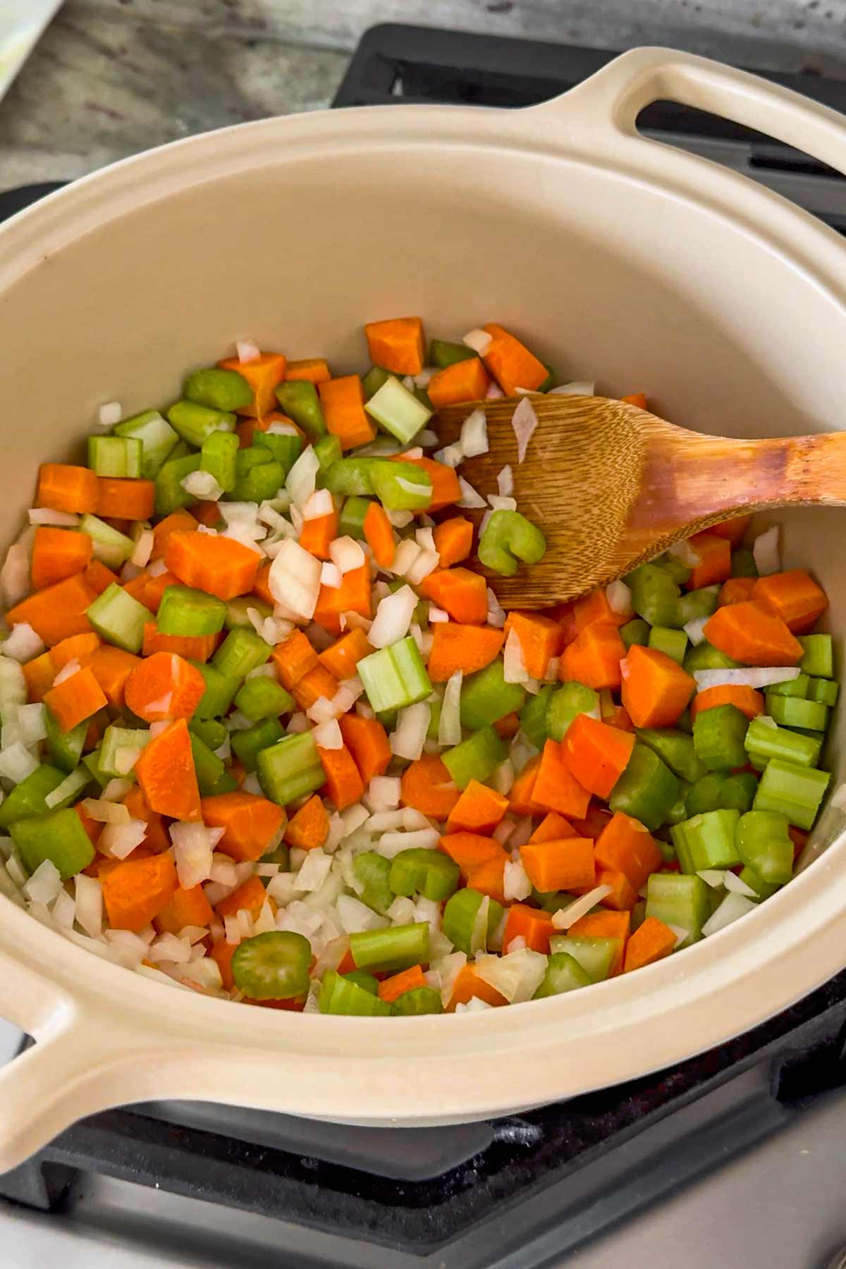 sauteeing onion, carrots, celery in a dutch oven