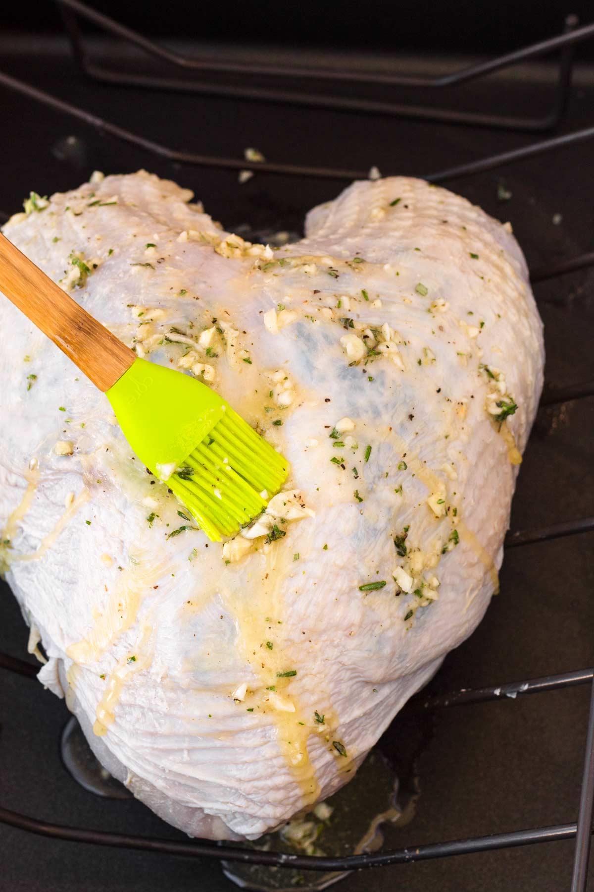 brushing exterior or the turkey breast with garlic herb butter