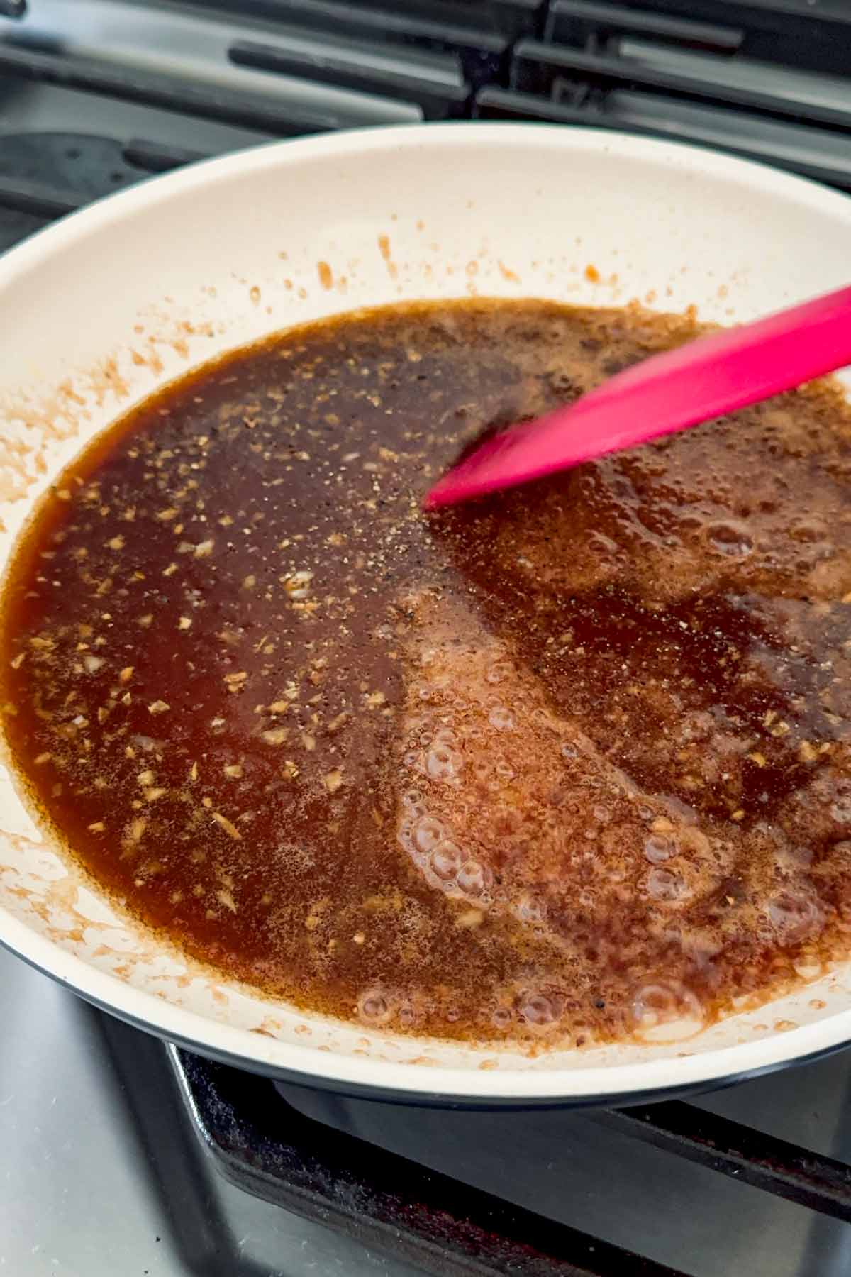 making brown sugar balsamic glaze in skillet