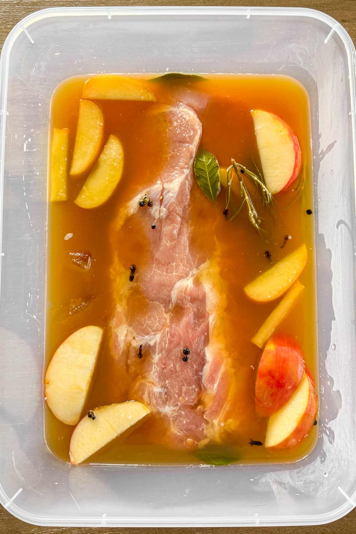 pork loin in the apple cider brine in container