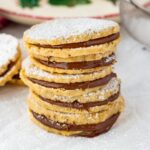 nutella shortbread sandwich cookies stacked with confectioners sugar dusting