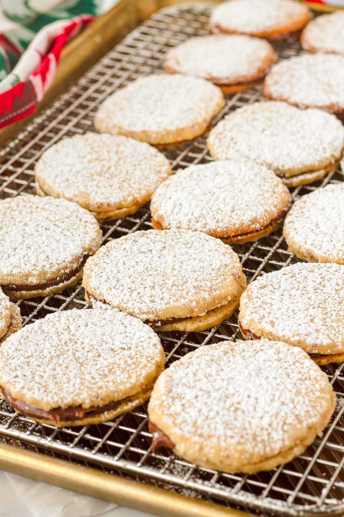 dusted nutella sandwich cookies on wire rack
