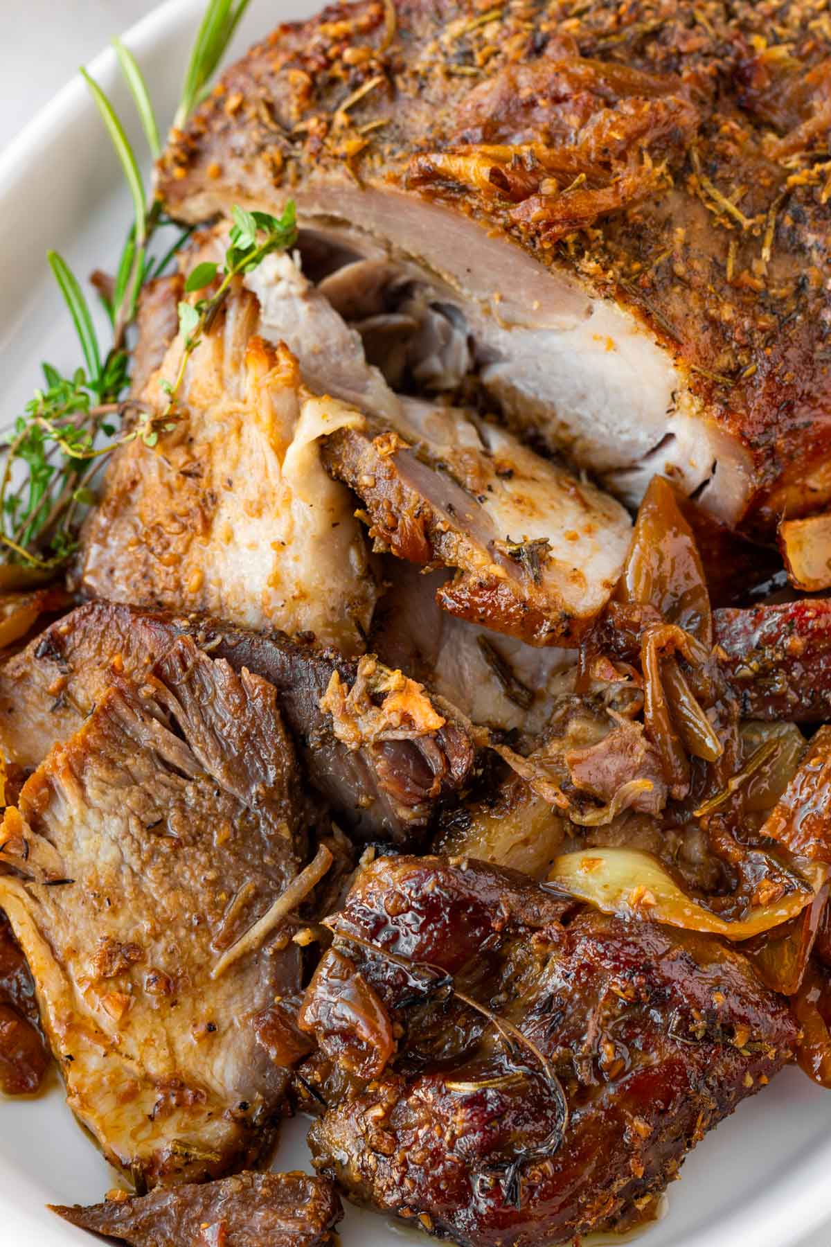 sliced pork shoulder roast with onions