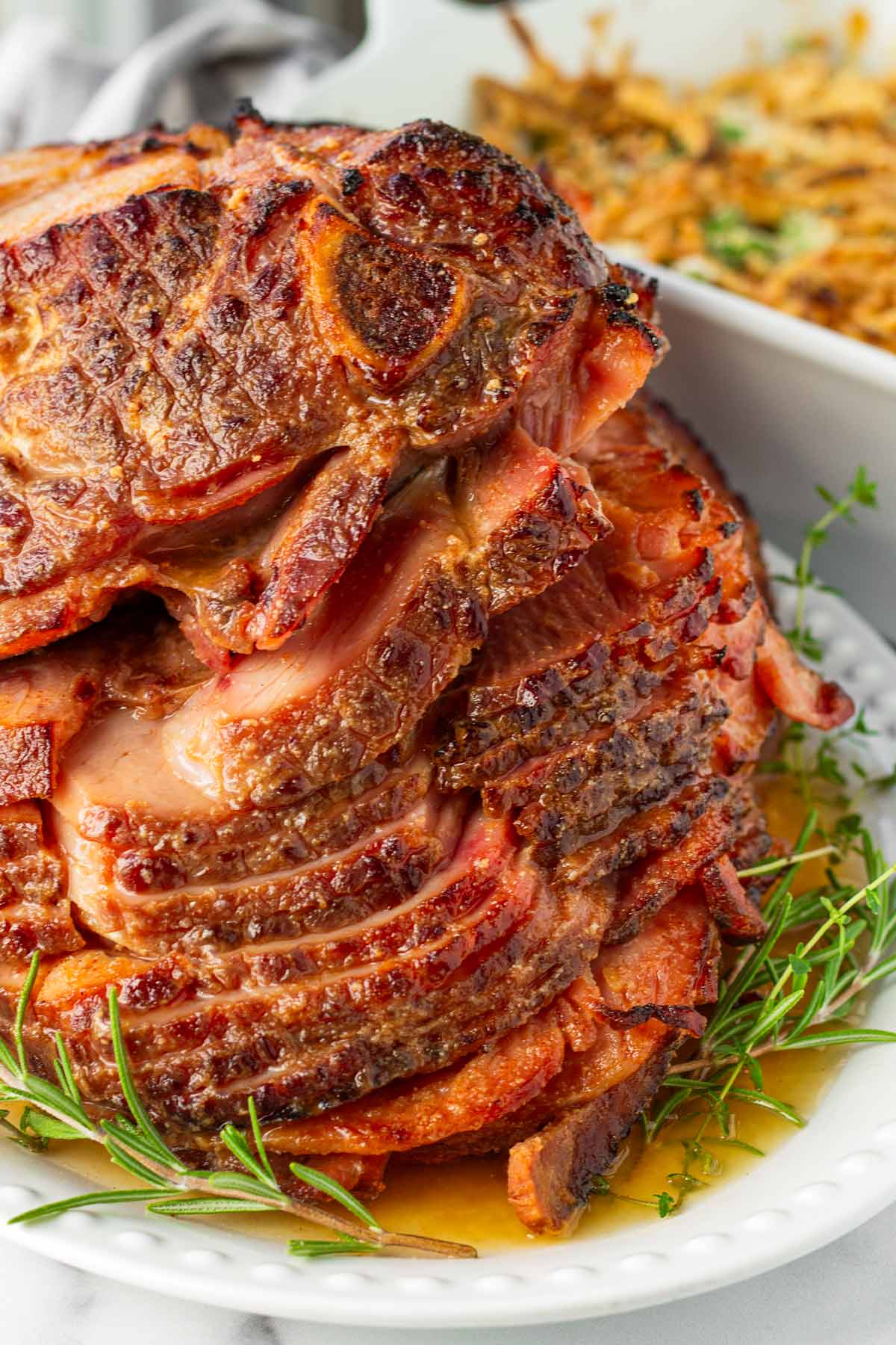 sliced slow cooked glazed ham on plate