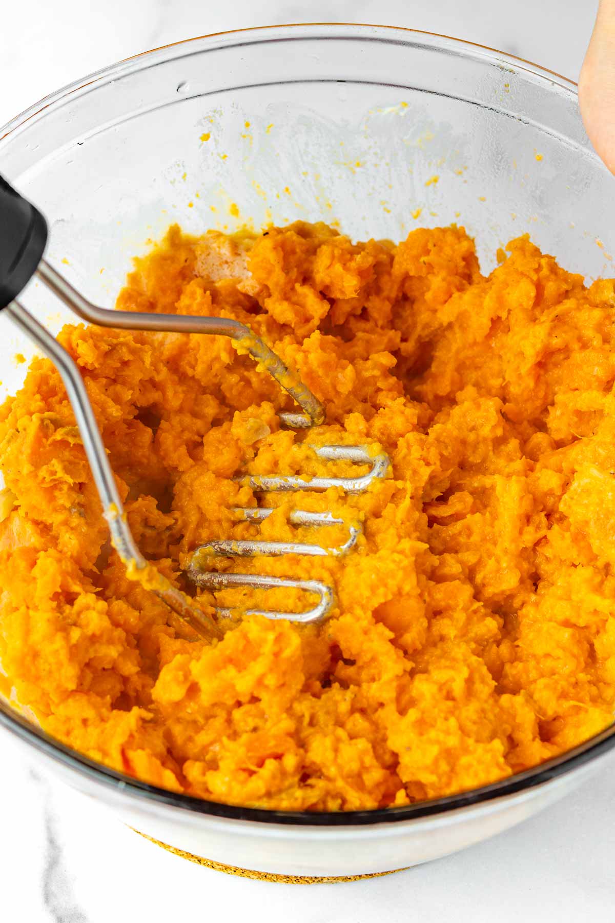 mashing sweet potatoes and mixture with mashed