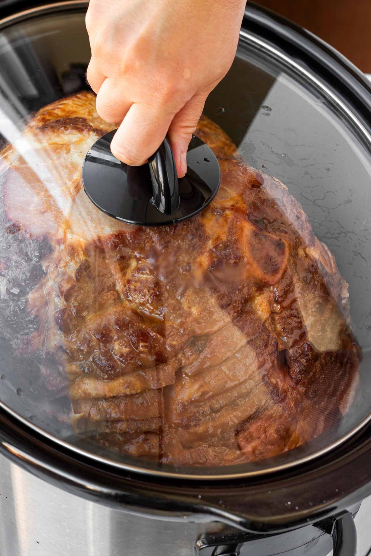 covering the slow cooker with the lid