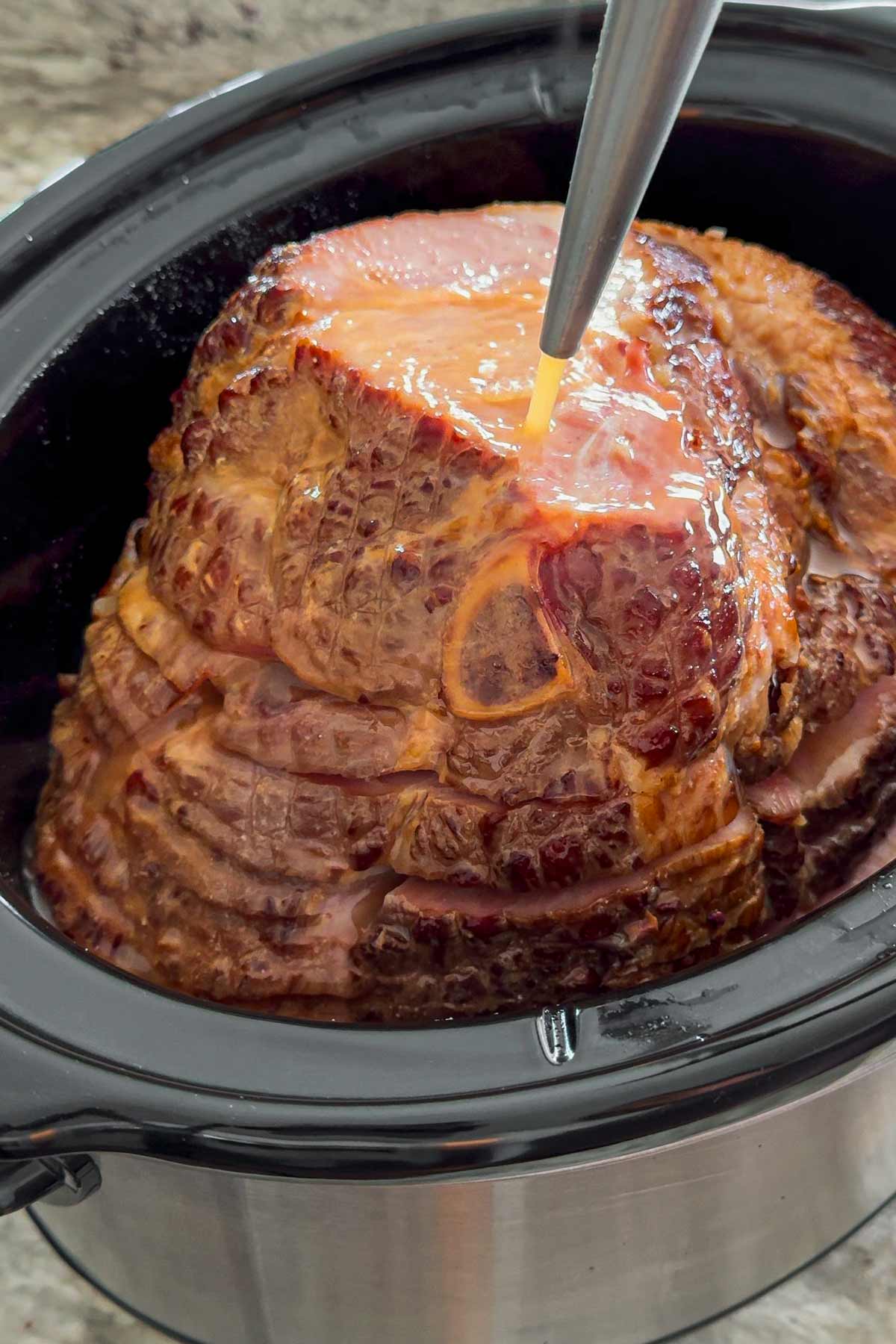 basting the ham with a baster