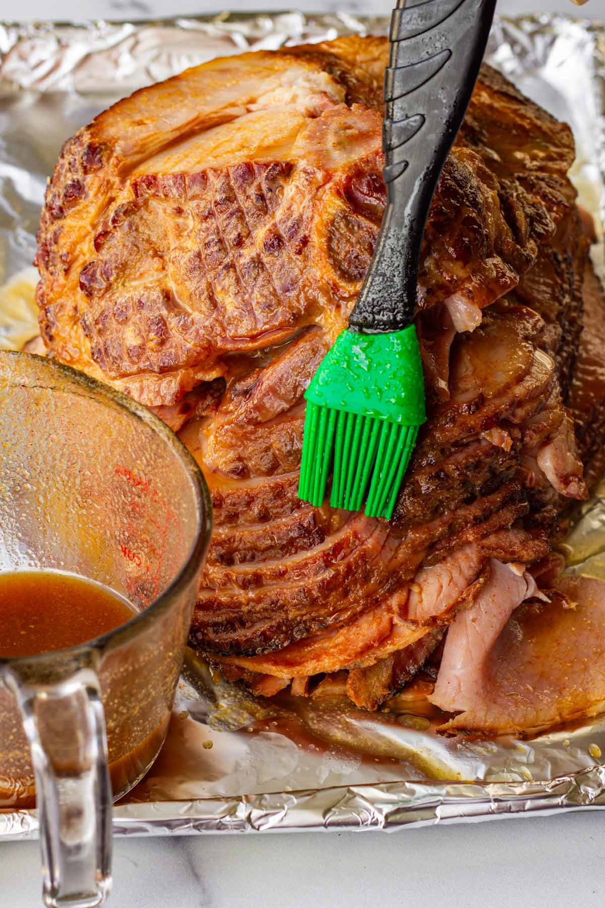 brushing ham with remaining glaze before broiling in the oven