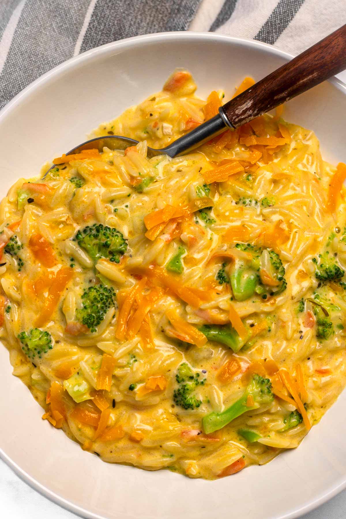 bowl of creamy broccoli cheddar orzo