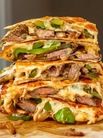 steak quesadillas stacked on top of each other