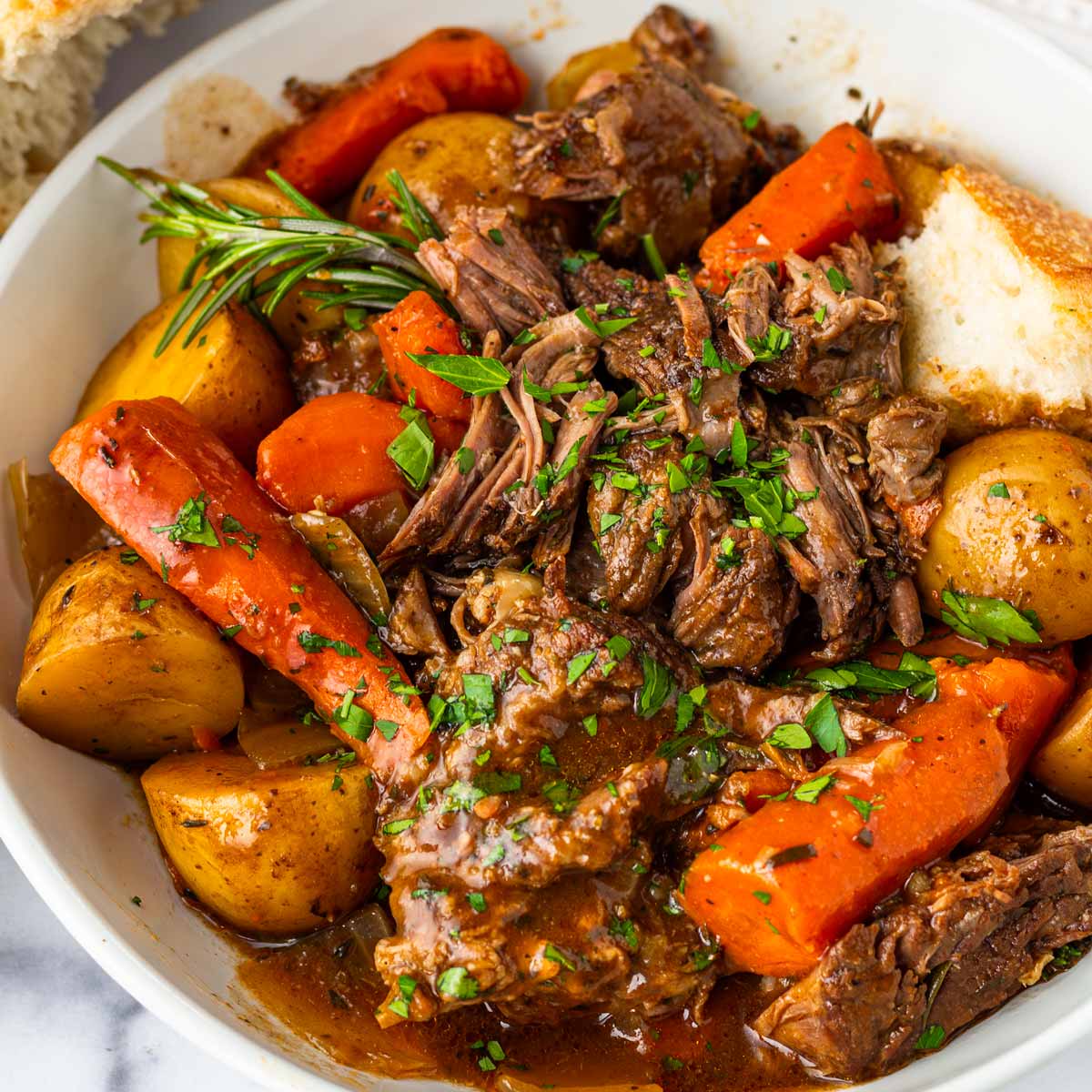 slow cooker pot roast with herbs, potatoes and carrots
