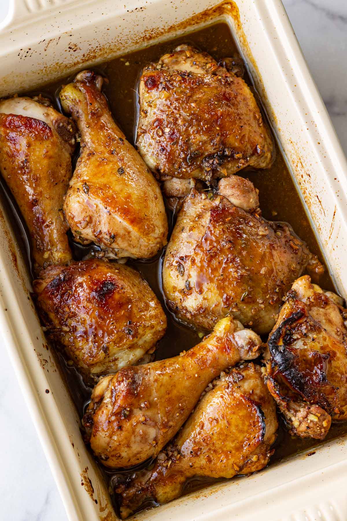 honey balsamic chicken thighs and drumsticks in baking pan
