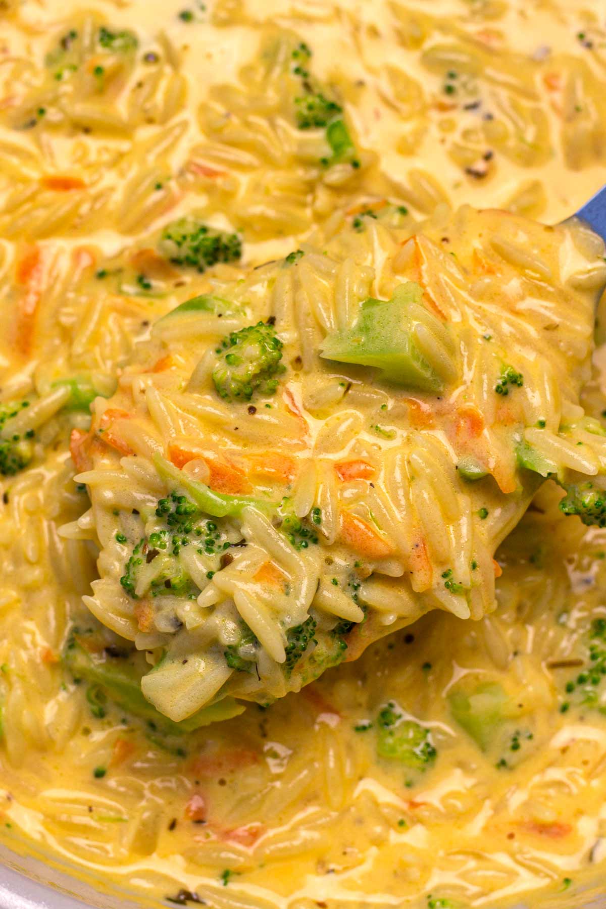 creamy broccoli cheddar orzo in pan