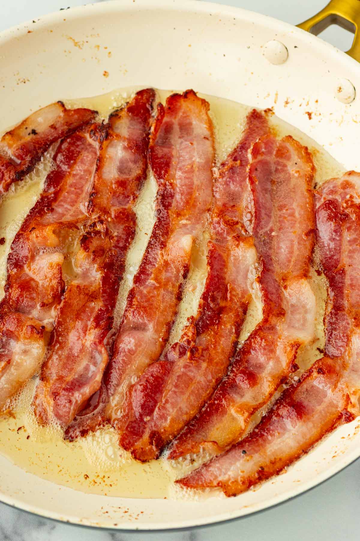 cooking bacon in a skillet