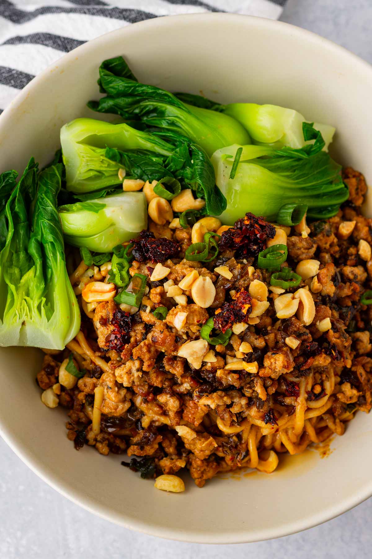 bowl of spicy saucy dan dan noodles