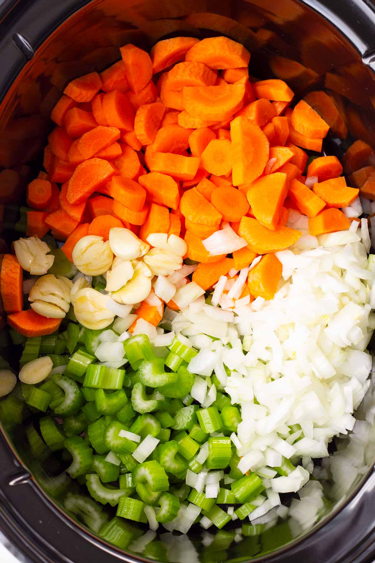 onions, carrots, celery, garlic in crock pot