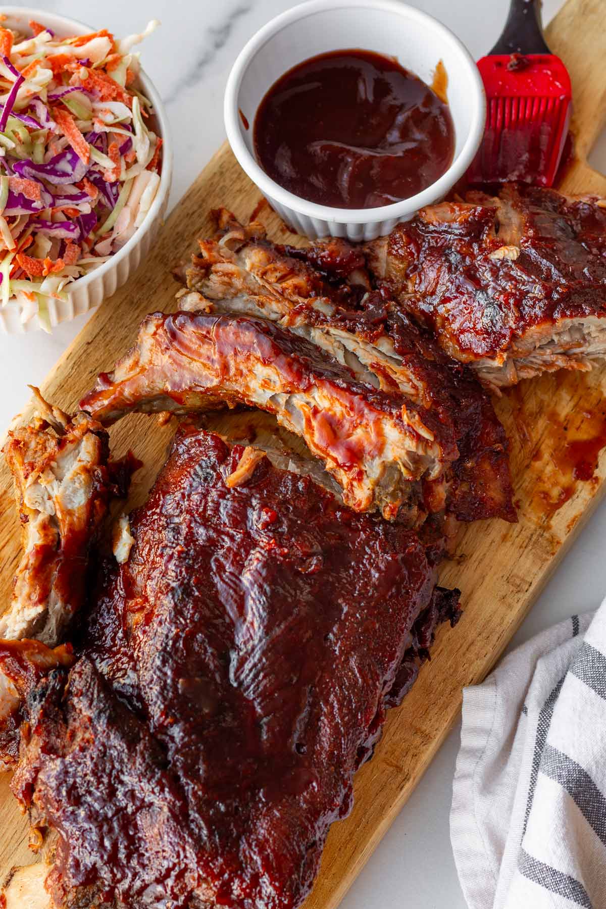 oven baked bbq ribs with sauce and slaw