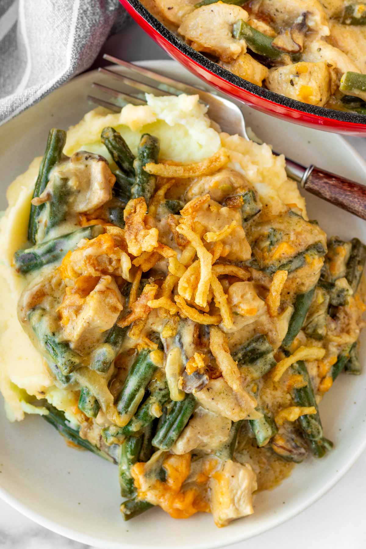 green bean chicken casserole served over mashed potatoes